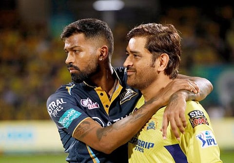 Chennai Super Kings Skipper MS Dhoni (right) with Gujarat Titans captain Hardik Pandya.