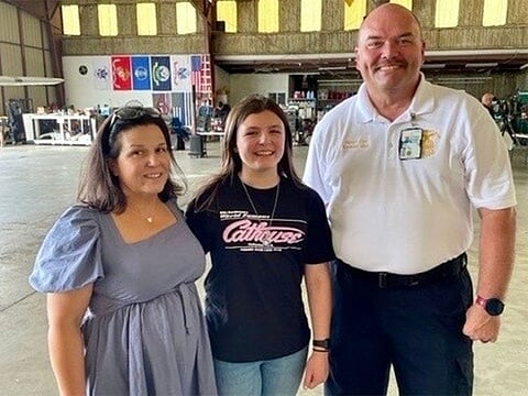 From left: Mary Majcunich-Beasley, Malia Beasley and Raymond Sikes celebrate Malia Beasley's high school graduation Saturday.