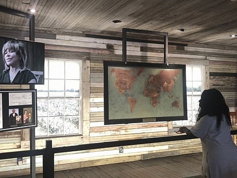 Lisa Lyons, 56, looks at an exhibit inside the Tina Turner Museum at the Flagg Grove School at the West Tennessee Delta Heritage Center on Wednesday, May 24, 2023, in Brownsville, Tenn. Turner, the unstoppable singer and stage performer who teamed with husband Ike Turner for a dynamic run of hit records and live shows in the 1960s and ‘70s and triumphed in middle age with the chart-topping "What's Love Got to Do With It," has died at 83. Turner died Tuesday, after a long illness in her home in Kuesnacht near Zurich, Switzerland, according to her manager. (AP Photo/Adrian Sainz)