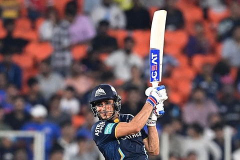 Gujarat Titans' Shubman Gill plays a shot during the Indian Premier League (IPL) Twenty20 second qualifier cricket match against Mumbai Indians at the Narendra Modi Stadium in Ahmedabad.