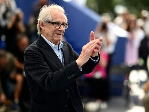 British director Ken Loach applauds during a photocall for the film 'The Old Oak' during the 76th edition of the Cannes Film Festival in Cannes, southern France, on May 27, 2023.
