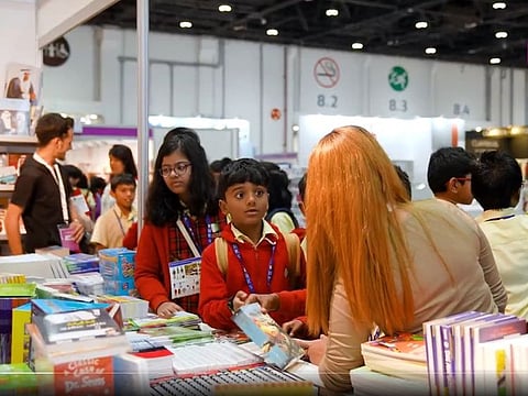 Still from clip tweeted by the book fair showing students selecting their favourite reads