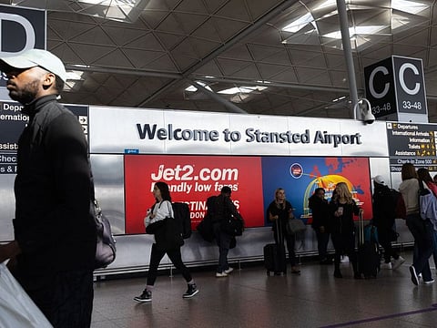 Passengers inside the main terminal building at London Stansted Airport. The Home Office, the government agency responsible for immigration and borders, said it was working to correct a “nationwide border system issue,” though it provided no details about what caused the problem.