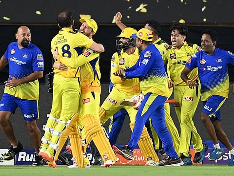 Chennai Super Kings' players celebrate their win at the end of the Indian Premier League (IPL) Twenty20 final cricket match between Gujarat Titans and Chennai Super Kings at the Narendra Modi Stadium in Ahmedabad.