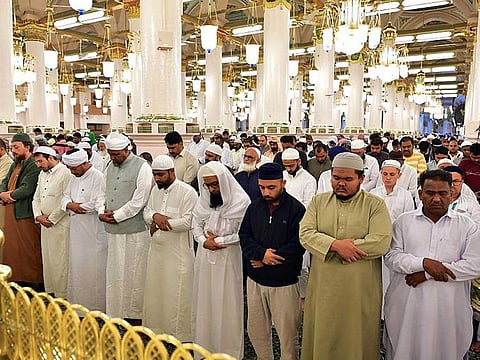 Worshippers perform prayers at the Prophet’s Mosque in Medina.