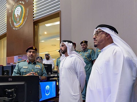 (centre) Lieutenant General Sheikh Saif bin Zayed Al Nahyan, Deputy Prime Minister and Minister of the Interior being briefed about the features of the Room. To his left is Lieutenant General Dhahi Khalfan Tamim, Deputy Chief of Police and Public Security in Dubai.