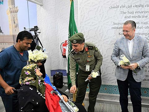 Turkish pilgrims are welcomed by Saudi and Turkish officials upon their landing at the Prince Mohammed bin Abdulaziz in Medina.