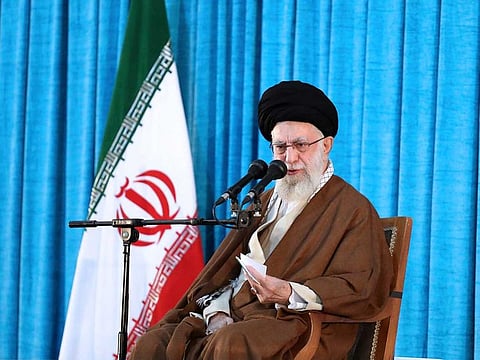 In this picture released by the official website of the office of the Iranian supreme leader, Ayatollah Ali Khamenei speaks during a ceremony commemorating the death anniversary of the late revolutionary founder Ayatollah Khomeini at his mausoleum just outside Tehran, Iran, Sunday, June 4, 2023.