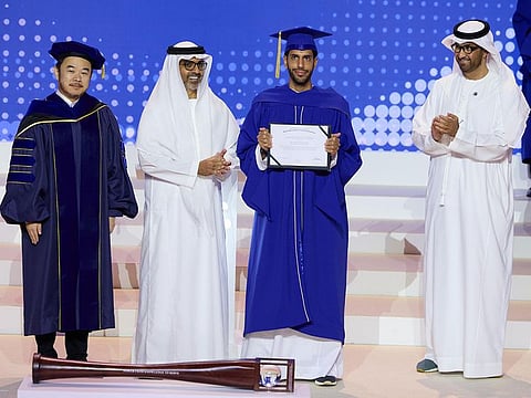 Sheikh Hamed bin Zayed Al Nahyan (second from left) with a graduate. Also seen are Dr Sultan bin Ahmed Al Jaber (extreme right), Minister of Industry and Advanced Technology, President-Designate of COP28 UAE and Chairman of MBZUAI’s Board of Trustees, and Professor Eric Xing, MBZUAI President and University Professor.