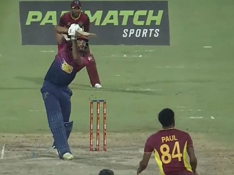 UAE debutant Ali Naseer plays a lofted cover drive to the fence in the first One-Day International against West Indies.