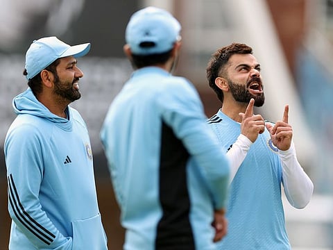 India captain Rohit Sharma and Virat Kohli share a light moment during a practice session at The Oval on Monday.