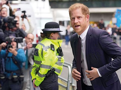 Prince Harry arrives at the High Court in London to testify against a tabloid publisher he accuses of phone hacking and other unlawful snooping.