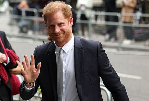 Britain's Prince Harry, Duke of Sussex, waves as he arrives to the Royal Courts of Justice, Britain's High Court, in central London on June 7, 2023.