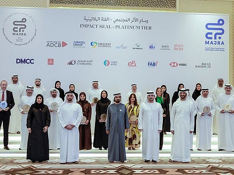 Sheikh Mohammed bin Rashid Al Maktoum with officials and winners of the award.