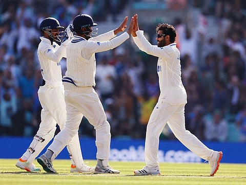 India’s Ravindra Jadeja celebrates with teammates after taking the wicket of Australia’s Travis Head on Day 3 of the ICC World Test Championship cricket final against Australia at The Oval, in London, on June 9, 2023. Jadeja’s two strikes have given India a glimmer of hope.