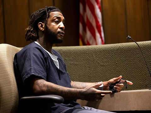 Jermarcus Johnson, who is accused of aiding in the hideout and escape of Justin Johnson and Cornelius Smith after they shot rapper Young Dolph, listens to a question Assistant District Attorney Paul Hagerman while on the stand , Friday, June 9, 2023, at the Shelby County Criminal Court in Memphis, Tenn. Johnson, 26, pleaded guilty Friday to three counts of accessory after the fact. (Chris Day/The Commercial Appeal via AP)