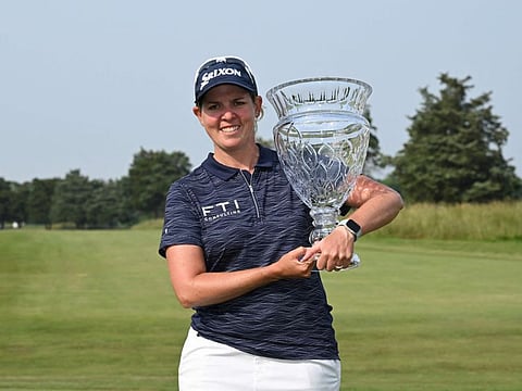Ashleigh Buhai of South Africa poses for a photo with the trophy after winning the ShopRite LPGA Classic at Seaview Bay Course on Sunday.