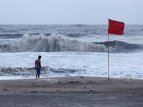 A lifeguard patrols Juhu beach, during a red flag alert due to rough seas caused by cyclone Biparjoy, in Mumbai, India, June 12, 2023.
