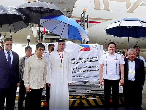 Mohamed Obaid Salem Alqataam Alzaabi, the UAE ambassador to the Philippines, with senior Philippine officials who received the food and medicines aid from the United Arab Emirates for the Mayon volcano crisis.