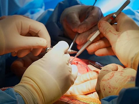The medical team performing a delicate, potentially life-changing in-utero spina bifida surgery in the UE at Burjeel Medical City.