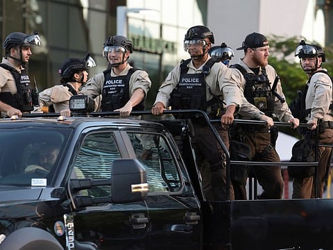 Members of law enforcement ride past the Wilkie D. Ferguson, Jr. US Courthouse on June 13, 2023 in Miami.