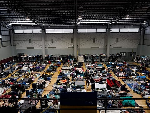 Ukrainian refugees wait in a gymnasium, April 5, 2022, in Tijuana, Mexico. Some 110 million people around the world have had to flee their homes because of conflict, persecution, or human rights violations, the UN High Commissioner for Refugees says.