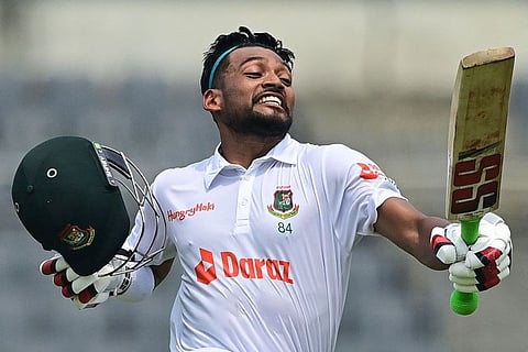 Bangladesh's Najmul Hossain Shanto celebrates after scoring his century during the first day of the Test against Afghanistan.