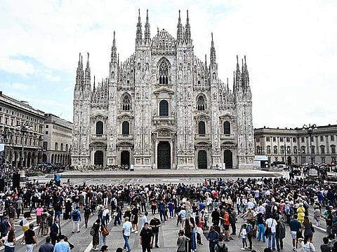 People gather outside the Duomo cathedral in Milan on June 14, 2023 ahead of the state funeral for Italy's former prime minister and media mogul Silvio Berlusconi.