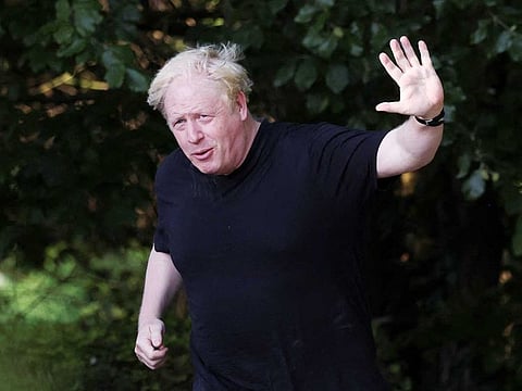 Former British Prime Minister Boris Johnson gestures as he runs near his home in Brightwell-cum-Sotwell, Oxfordshire, Britain, June 15, 2023.