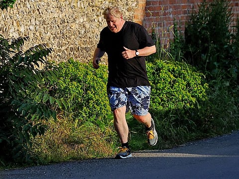 Former British Prime Minister Boris Johnson returns to his home after running, in Brightwell-cum-Sotwell, Oxfordshire, Britain, June 14, 2023