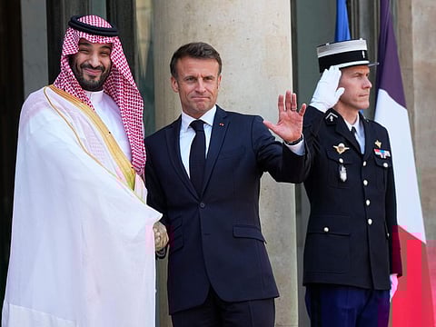 Saudi Crown Prince Mohammed bin Salman shakes hands with French President Emmanuel Macron, on  June 16, 2023 at the Elysee Palace in Paris.