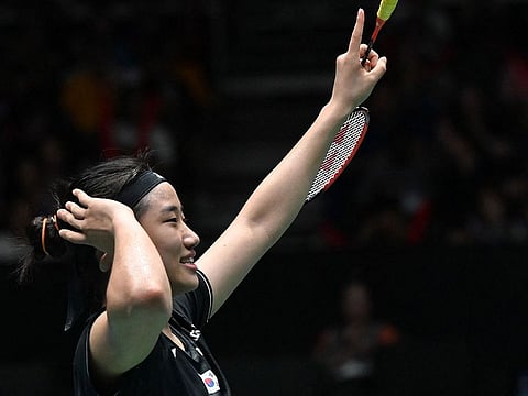 An Se-young of South Korea gestures after defeating Akane Yamaguchi of Japan in their women's singles final match at the Singapore Open badminton tournament in Singapore on June 11, 2023