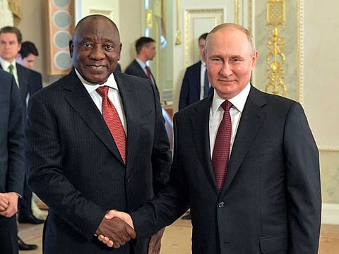This handout picture taken by RIA Novosti on June 17, 2023 shows Russian President Vladimir Putin (R) shaking hands with South Africa's President Cyril Ramaphosa (L) following a meeting with delegation of African leaders at the Constantine (Konstantinovsky) Palace in Strelna, outside Saint Petersburg.