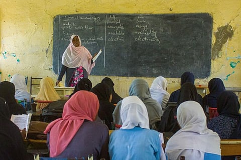 A picture taken on June 15, 2023, shows students attending a lesson at a secondary school for girls in Wad Madani, the capital of Sudan's Al Jazirah state, amid disruptions in classes as fighting continues in Sudan.