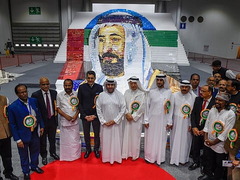 Sheikh Majid Bin Sultan Bin Saqer Al Qasimi, Indian Consul General Dr Aman Puri, artist Davinchi Suresh and officials at the unveiling of 3D art installation of His Highness Sheikh Dr. Sultan bin Muhammad Al Qasimi, Supreme Council Member and Ruler of Sharjah made with One Hundred Thousand books by artist Davinchi Suresh.. Photo: Virendra Saklani/Gulf News.