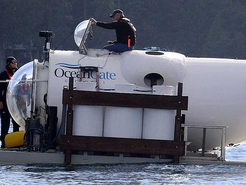 OceanGate CEO Stockton Rush emerges from the hatch atop the OceanGate submarine Cyclops 1 in the San Juan Islands, Wash., on Sept. 12, 2018.