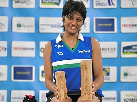 Tanisha Crasto with her trophies after winning the gold and silver in the Nantes International Challenge on Sunday.