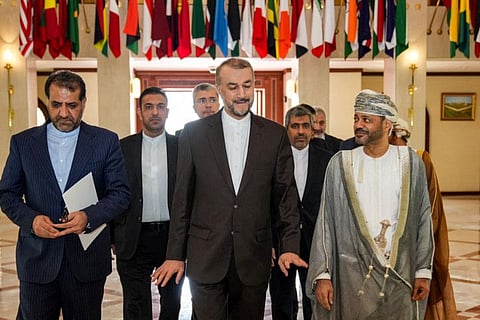 Iran's Foreign Minister Hossein Amir-Abdollahian (centre) being received by Oman's Foreign Minister Sayyid Badr Al Busaidi (right) in Muscat on June 21, 2023.