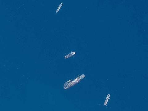 A satellite image shows ships taking part in the search and rescue operations associated with the missing Titan submersible near the wreck of the Titanic, on June 22, 2023.
