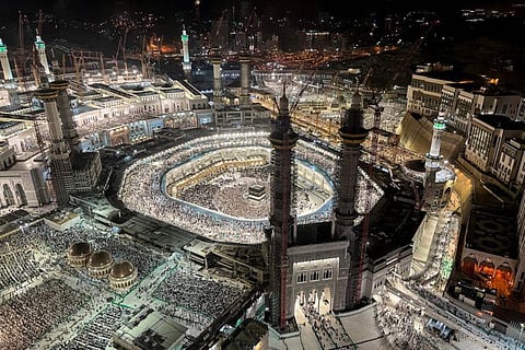 In this elevated view from a hotel overlooking the Grand Mosque, Muslim worshippers and pilgrims gather around the Kaaba, Islam's holiest shrine, in the holy city of Mecca on June 22, 2023, as they arrive for the annual Hajj pilgrimage. (Photo by Rania SANJAR / AFP)