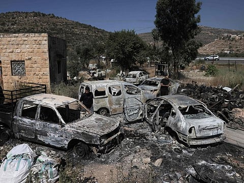A picture shows burnt cars, reportedly set ablaze by Israeli settlers, in the area of in Al Lubban Al Sharqiya in the West Bank on June 21, 2023.