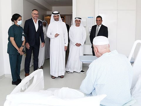 DHA Director-General Awadh Seghayer Al Ketbi (third from left) interacts with a patient at the newly-opened NMC Specialty Hospital in Dubai Investments Park on Friday