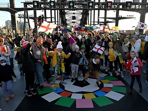 Participants take part in the 'Unity Celebrations,'  on the Sydney Harbour Bridge in Sydney on Sunday.