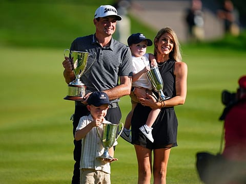 Keegan Bradley celebrates winning the Travelers Championship golf tournament with his family at TPC River Highlands on Sunday.