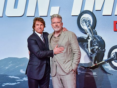 US actor Tom Cruise and director Christopher McQuarrie during the premiere of their film 'Mission: Impossible  Dead Reckoning Part One' in Abu Dhabi on June 26, 2023.