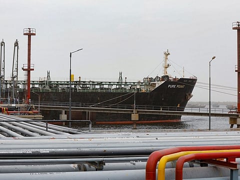 Crew members check the deck of the Russian oil cargo Pure Point, carrying crude oil, anchored at a port in Karachi, Pakistan June 13, 2023.