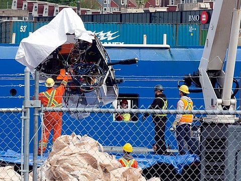 Debris from the Titan submersible, recovered from the ocean floor near the wreck of the Titanic, is unloaded from the ship Horizon Arctic at the Canadian Coast Guard pier in St. John's, Newfoundland.