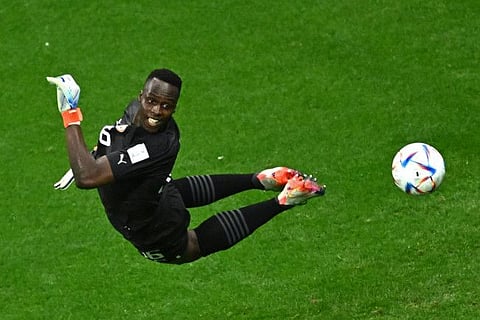 Senegal's goalkeeper Edouard Mendy dives to stop the ball during the Qatar World Cup against England at the Al Bayt Stadium last December.