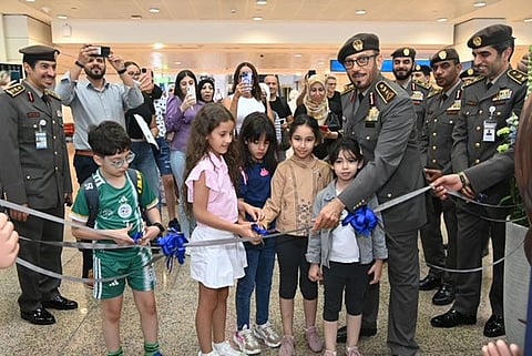 Lieutenant General Mohammed Ahmed Al Marri, Director General of the General Directorate of Residency and Foreigners Affairs in Dubai, with some children at one of the newly launched children's passport counters in Dubai Airports on Tuesday.