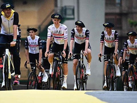 UAE Team Emirates' Slovenian rider Tadej Pogacar (centre) and teammates cycle to the stage during the official teams presentation near the Guggenheim Museum Bilbao, northern Spain, on Thursday.